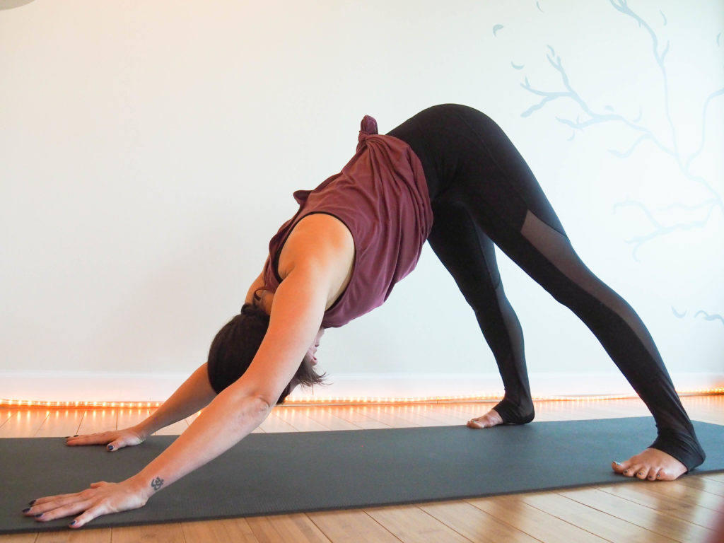 Extra wide downdog. How to modify your vinyasa yoga practice during pregnancy.