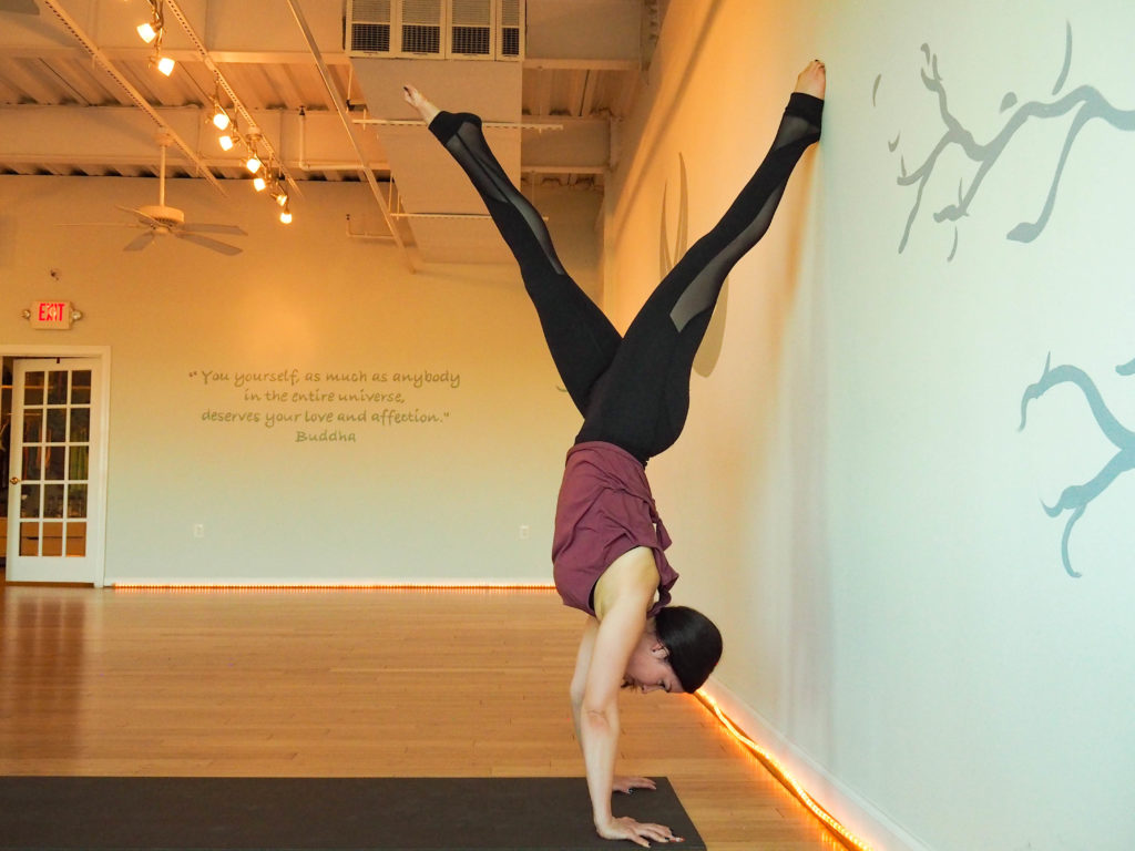 handstand at the wall yoga strengthening drill