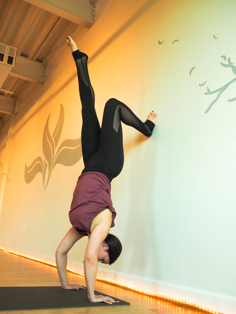handstand hold at the wall yoga strengthening drill