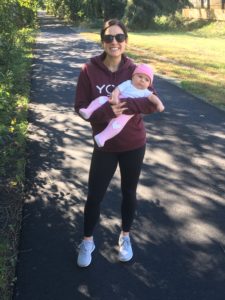 Mom with baby on a walk on a trail. Yoga practice off the mat. How to be happy and find extraordinary in the ordinary moments of life.