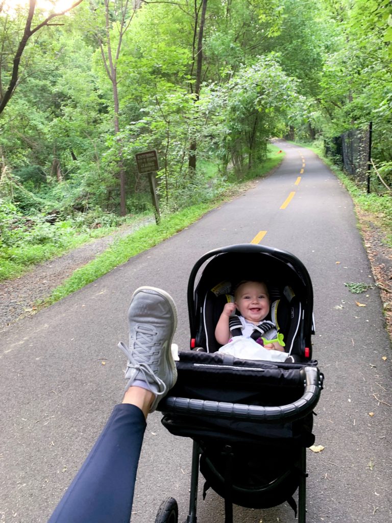 Baby in stroller and mom stretching; 10-minute workout to add to runs to tone & strengthen booty, arms, and belly